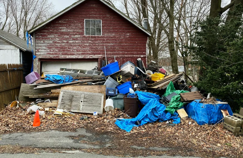 Discarded household items and debris awaiting a residential cleanout